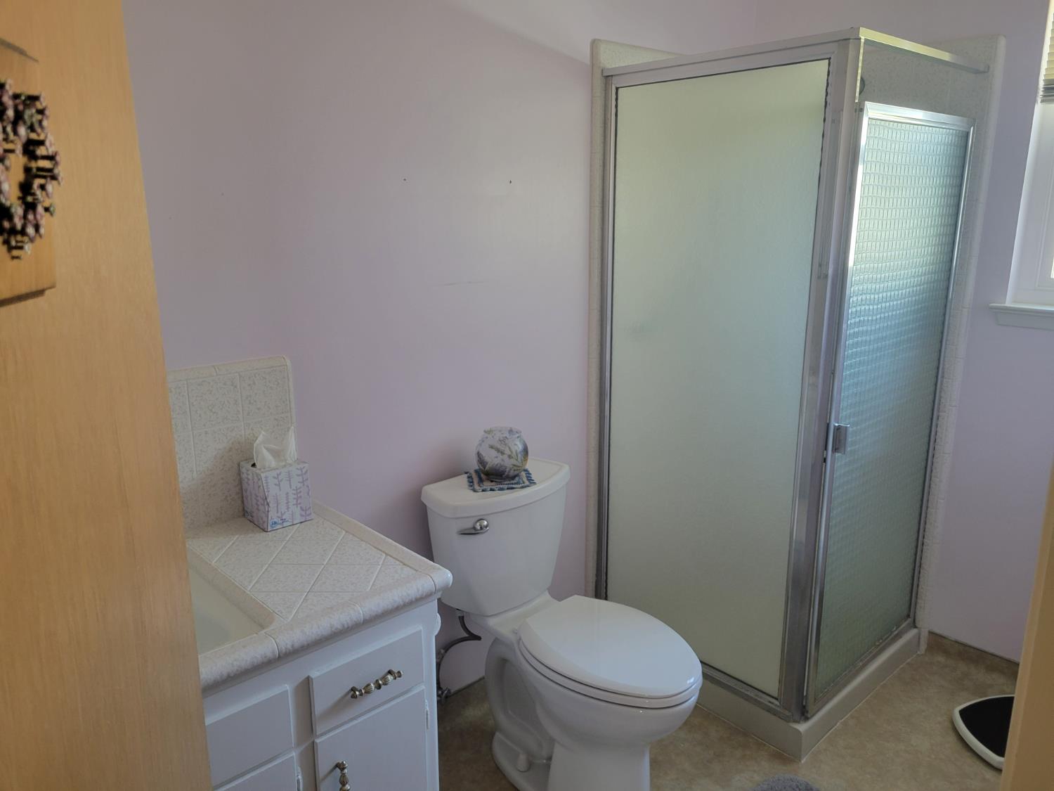 318 Williams Madera, CA 93637 - Photo 14 of 25 a bathroom with a granite countertop toilet and a sink