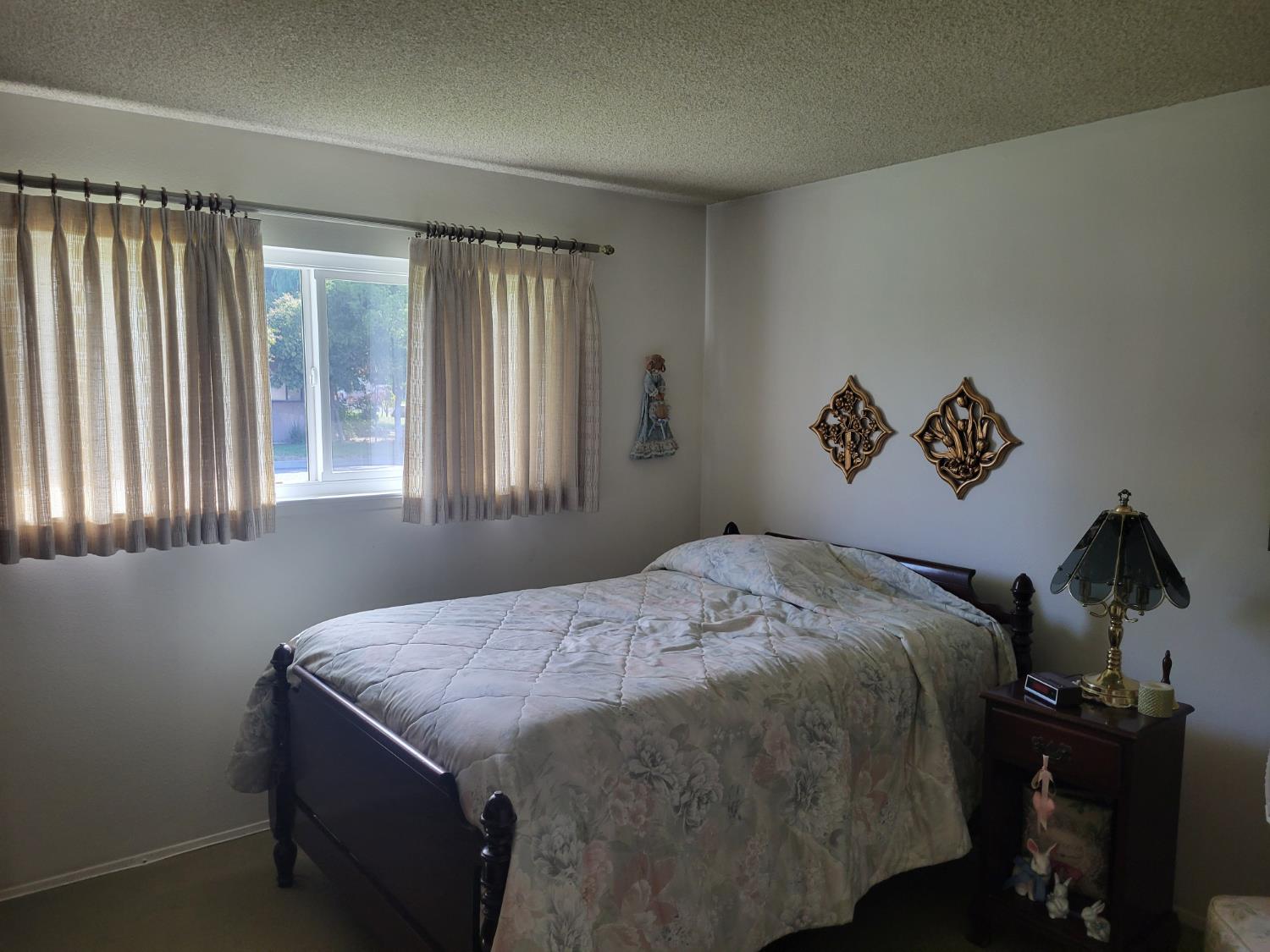 318 Williams Madera, CA 93637 - Photo 16 of 25 a bedroom with a bed and a window