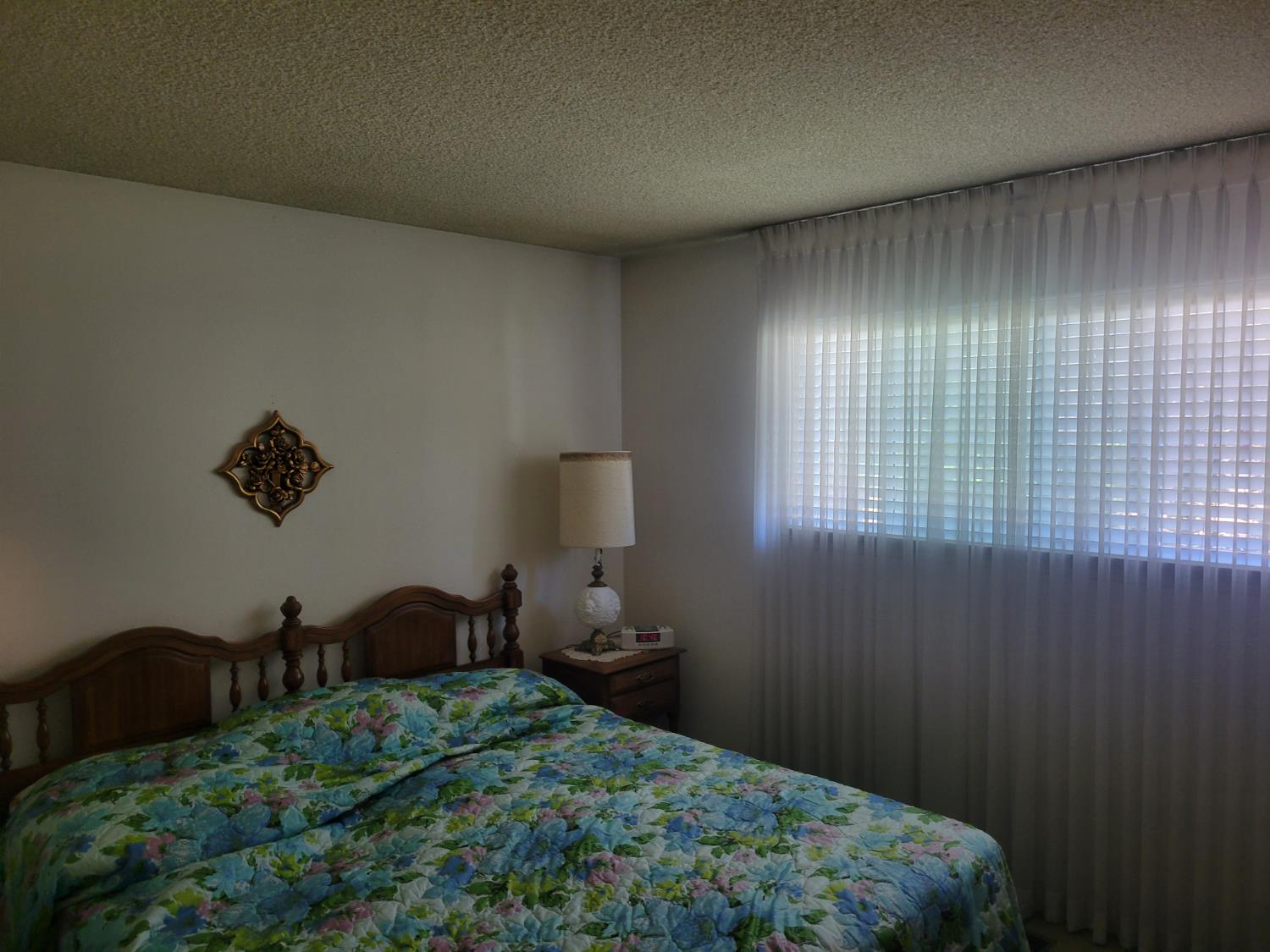 318 Williams Madera, CA 93637 - Photo 18 of 25 a bedroom with a bed and a window