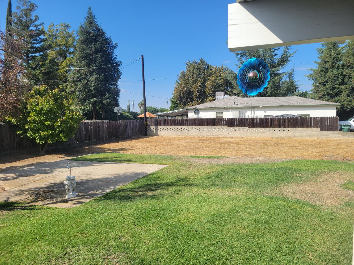 318 Williams Madera, CA 93637 - Photo 21 of 25 a view of a swimming pool with an outdoor space and seating area