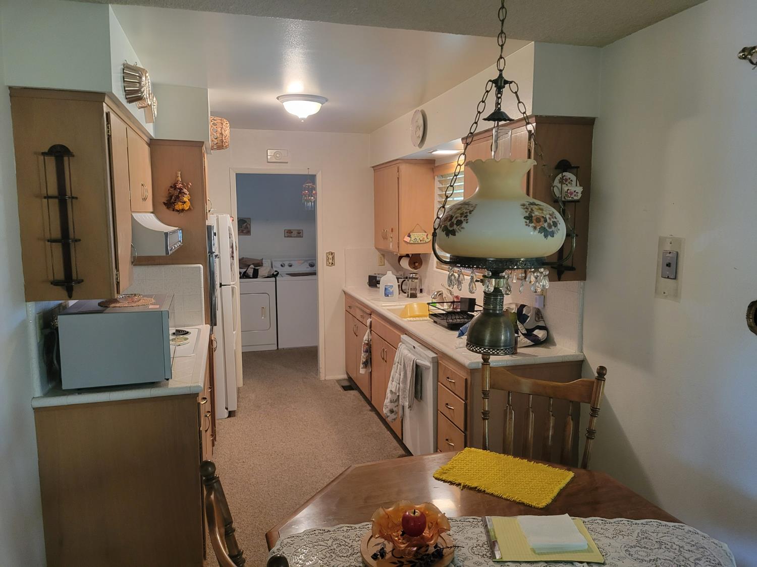 318 Williams Madera, CA 93637 - Photo 10 of 25 a bathroom with a sink a mirror a toilet and shower