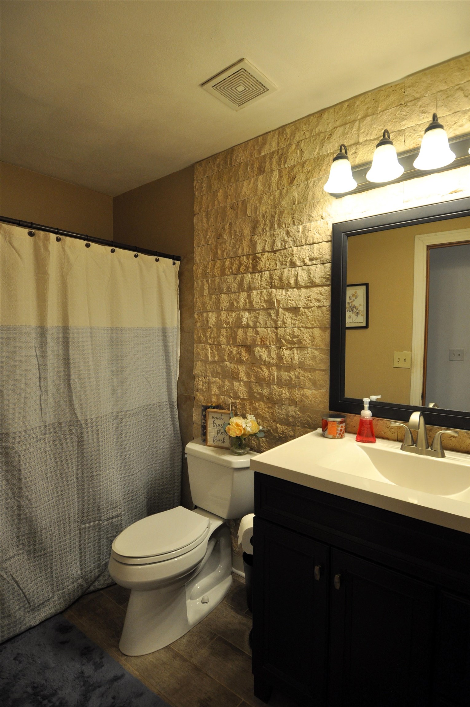 518 Merilot Drive Roscoe, IL 61073 - Photo 13 of 26 a bathroom with a sink a toilet and shower curtain
