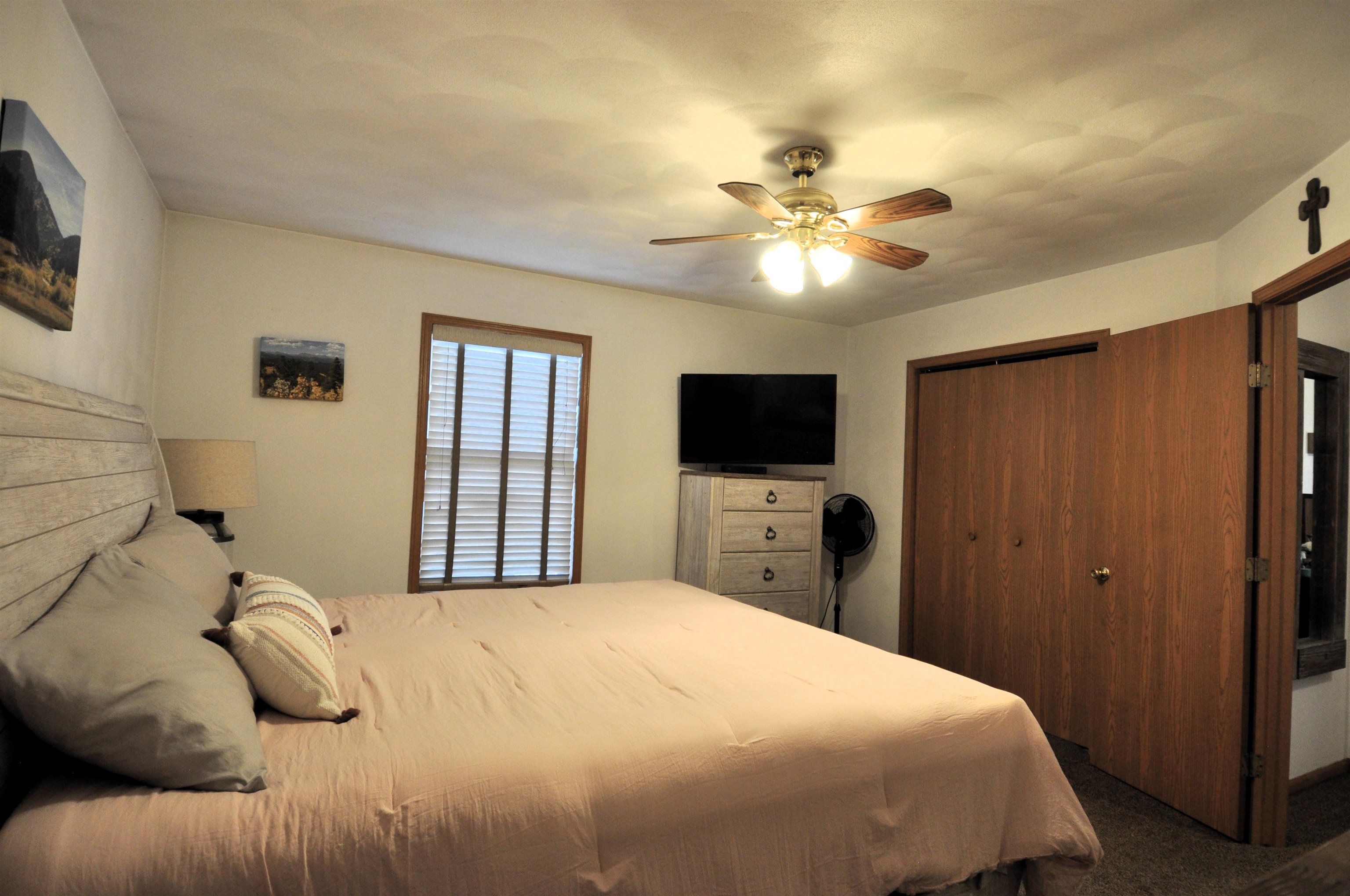 518 Merilot Drive Roscoe, IL 61073 - Photo 14 of 26 a bedroom with a bed and a flat screen tv