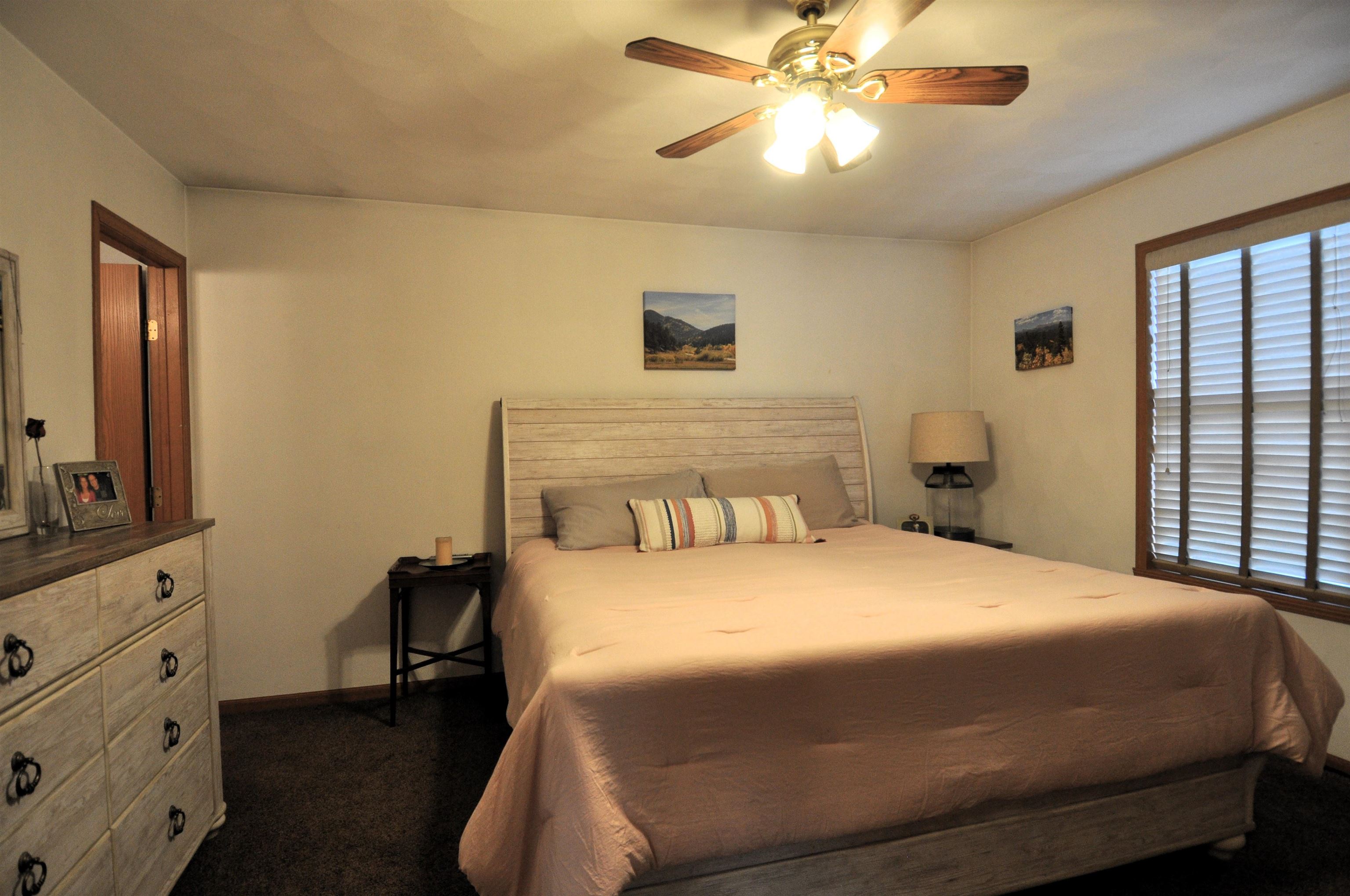 518 Merilot Drive Roscoe, IL 61073 - Photo 15 of 26 a bedroom with a bed and a chandelier