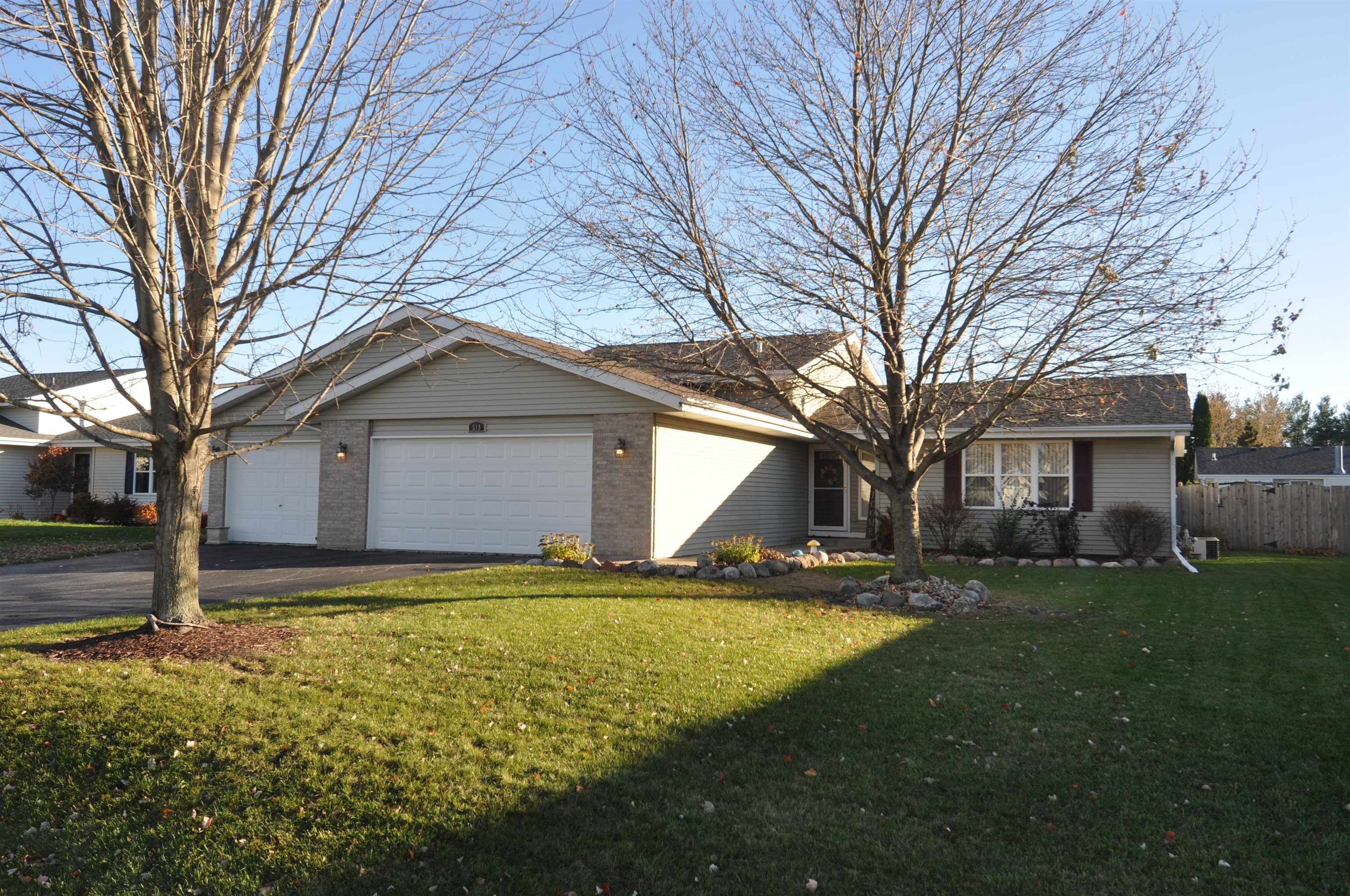 518 Merilot Drive Roscoe, IL 61073 - Photo 2 of 26 a front view of house with yard and trees