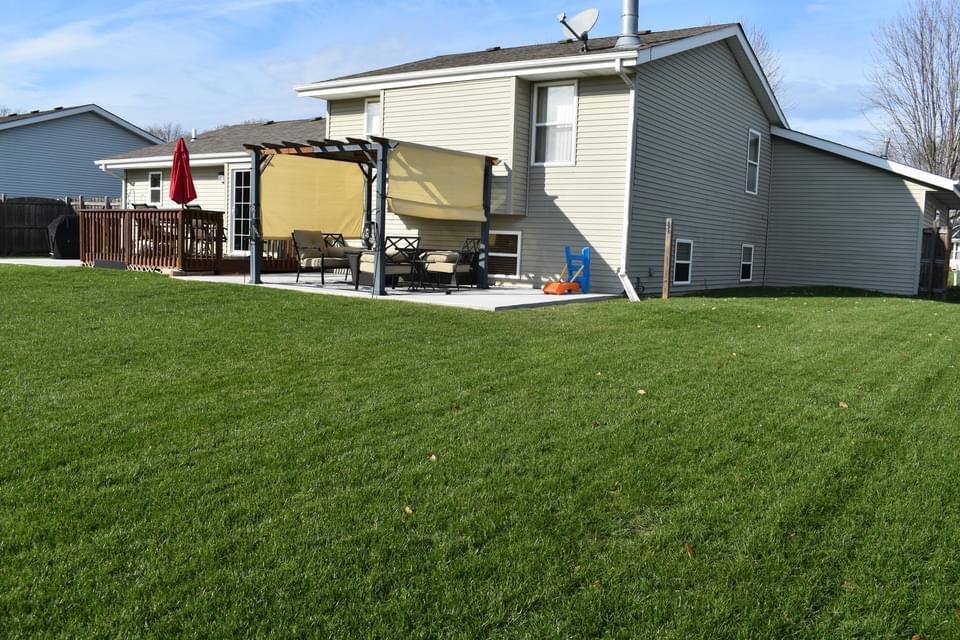518 Merilot Drive Roscoe, IL 61073 - Photo 21 of 26 a view of a back yard of the house