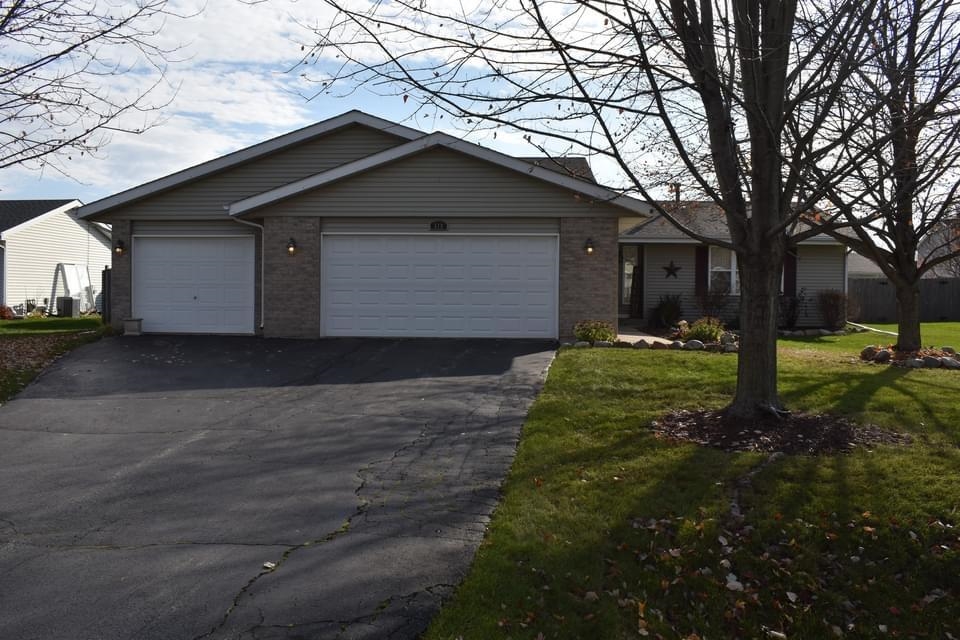 518 Merilot Drive Roscoe, IL 61073 - Photo 26 of 26 a front view of house with a garden