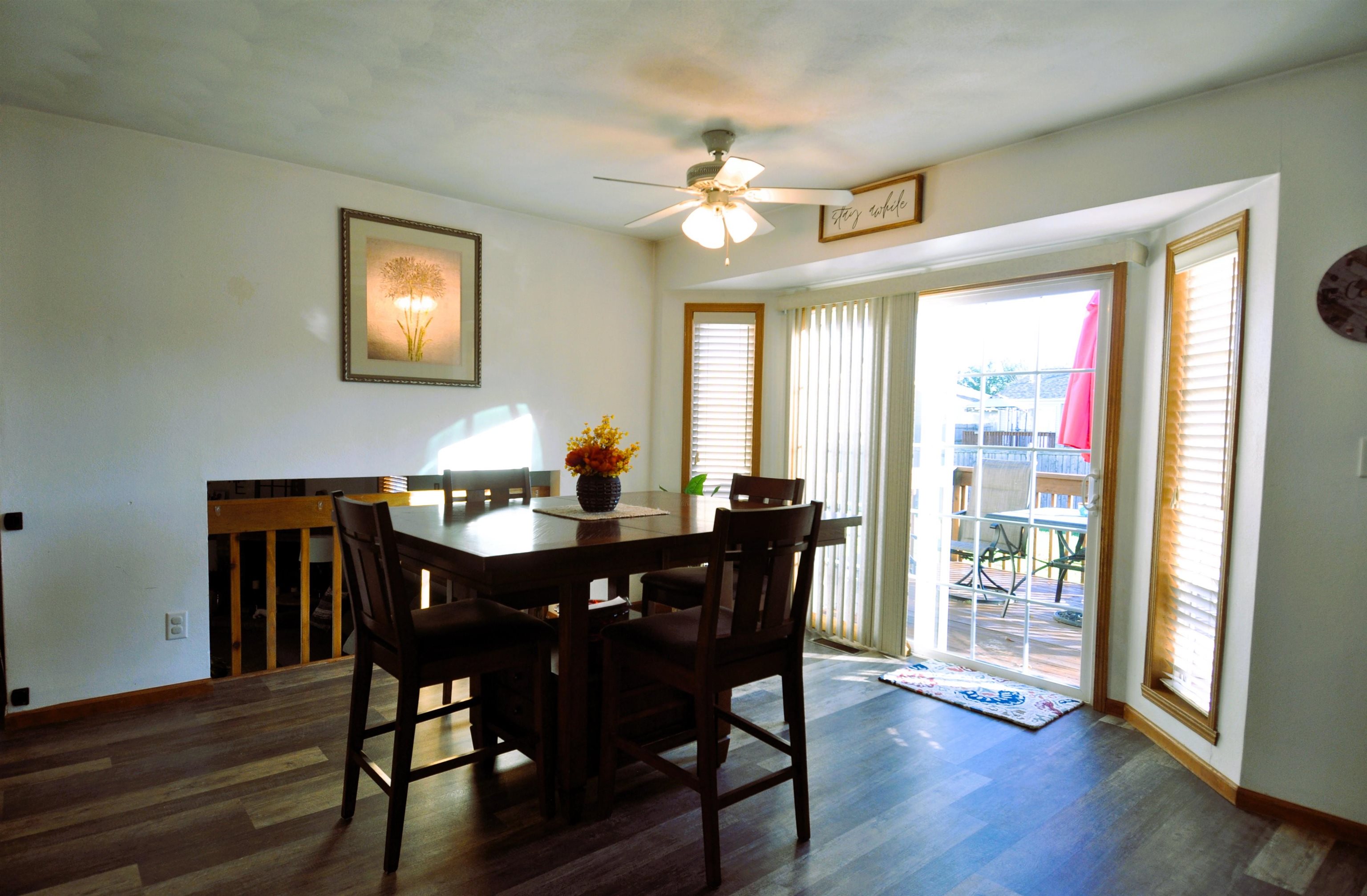 518 Merilot Drive Roscoe, IL 61073 - Photo 6 of 26 a view of a dining room with furniture window and wooden floor