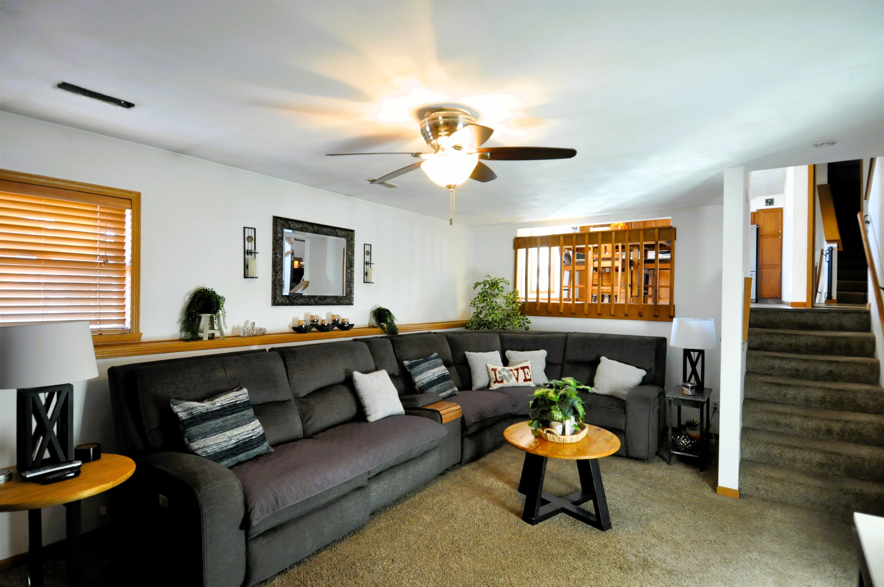 518 Merilot Drive Roscoe, IL 61073 - Photo 10 of 26 a living room with furniture a window and a chandelier