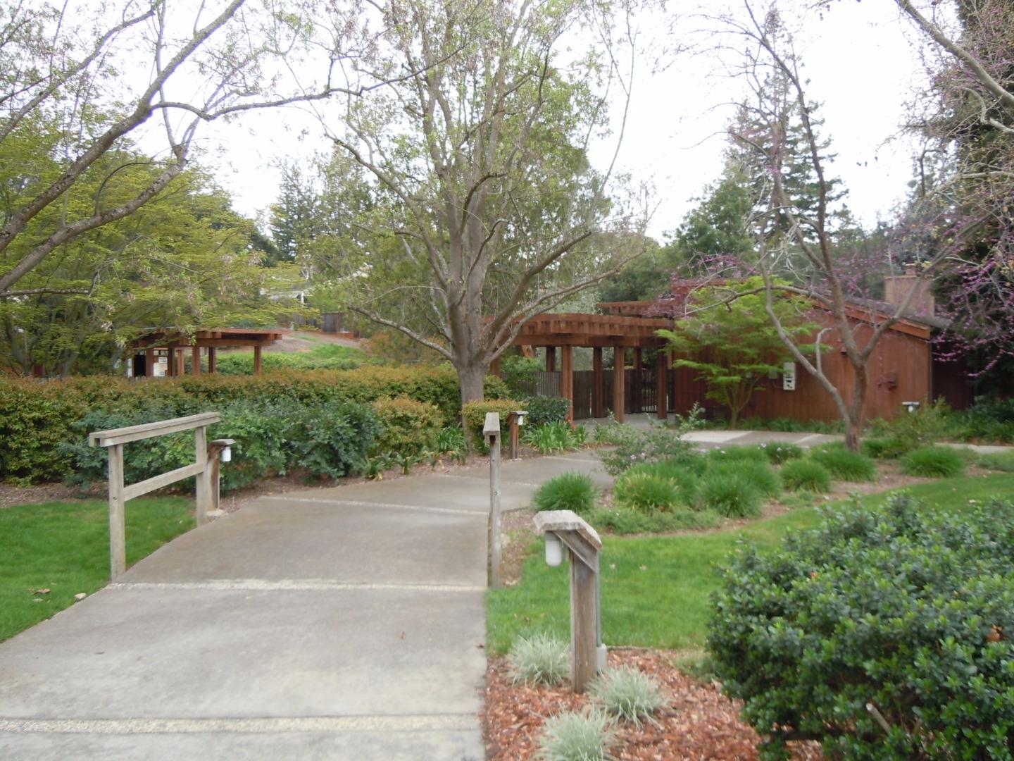 6 Farm Road Los Altos, CA 94024 - Photo 2 of 21 a front view of a house with a yard and shrubs