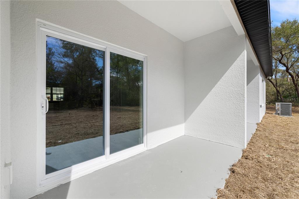 16082 Southwest 35th Court Road Ocala, FL 34473 - Photo 32 of 32 a view of a hallway with wooden floor and staircase
