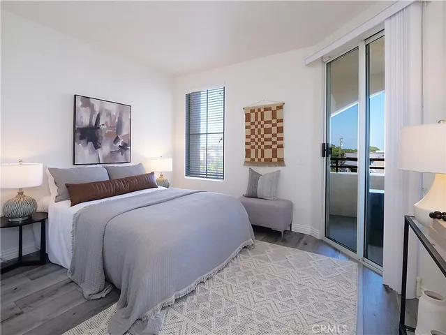 a bedroom with a bed and a couch