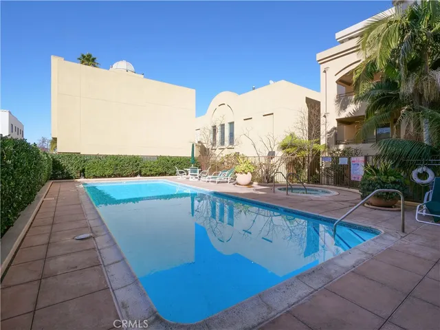 a view of swimming pool from a balcony