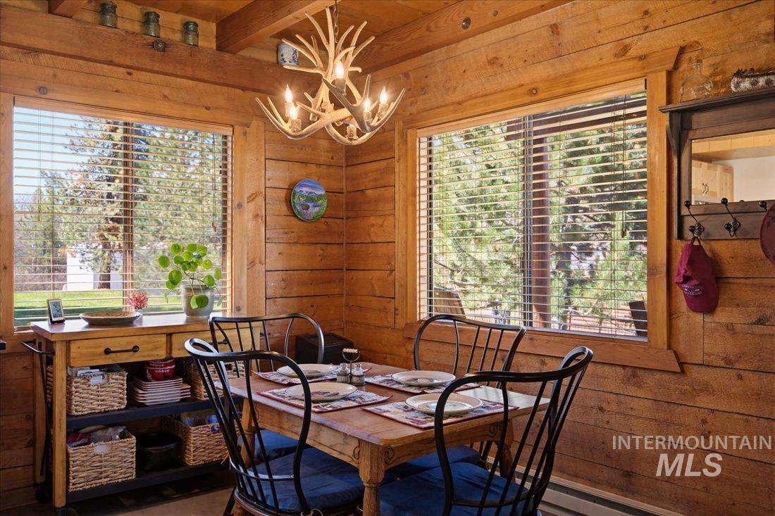 143 East Lk Frk Road McCall, ID 83638 - Photo 10 of 49 Decorative antler chandelier and two large windows