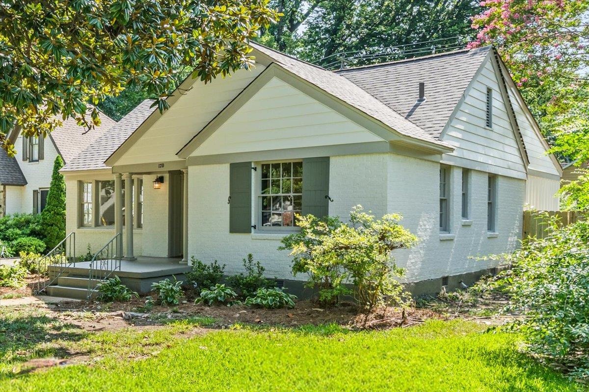 170 South Greer Street Memphis, TN 38111 - Photo 7 of 35 White brick exterior with a gray-shingled roof and dark gray shutters