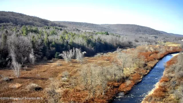 a view of a backyard with mountain view