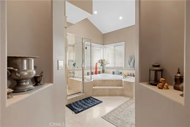 a large white kitchen with a large window
