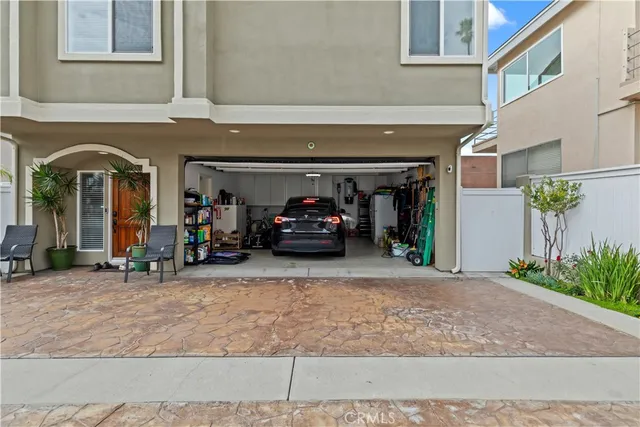 an aerial view of a house with a yard and lake view