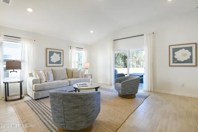 a view of a swimming pool and an outdoor seating