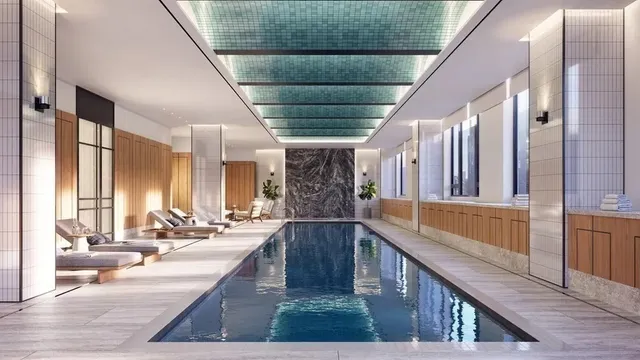 a view of swimming pool with outdoor seating