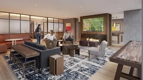 a living room with furniture kitchen view and a large window