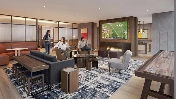 a living room with furniture kitchen view and a large window