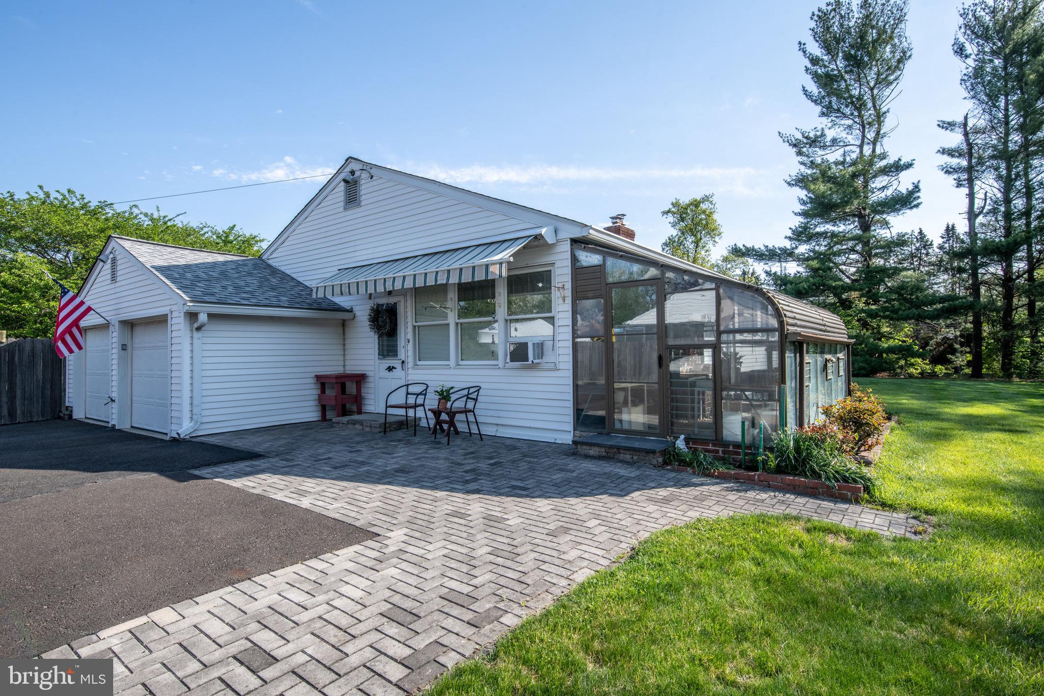418 Doublewoods Road Langhorne, PA 19047 - Photo 28 of 34 Four-season room opens to paver patio