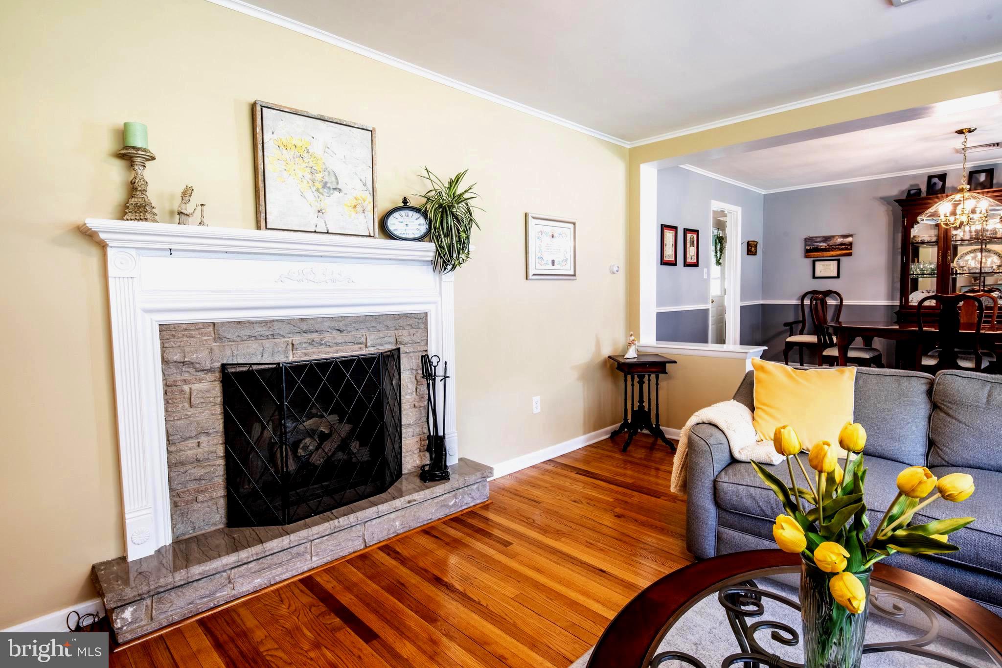 418 Doublewoods Road Langhorne, PA 19047 - Photo 10 of 34 Living room fireplace serves as a cozy focal point