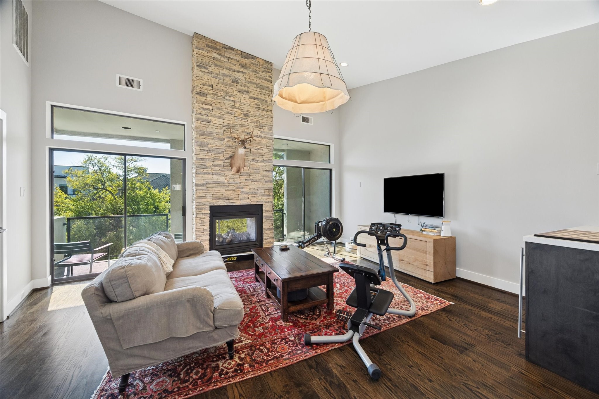 6504 Rodrigo Street, Unit B Houston, TX 77007 - Photo 26 of 29 With a two-sided stone fireplace and access to a large balcony.