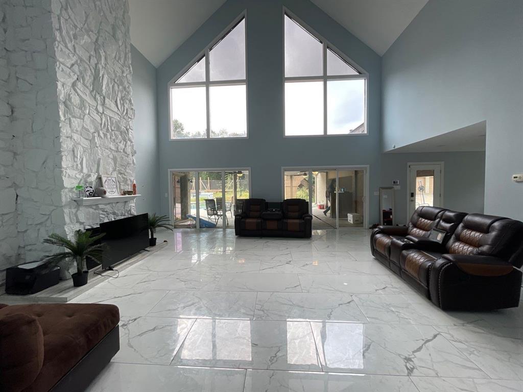 5890 Montgomery Road Midlothian, TX 76065 - Photo 12 of 38 a living room with furniture and a fireplace