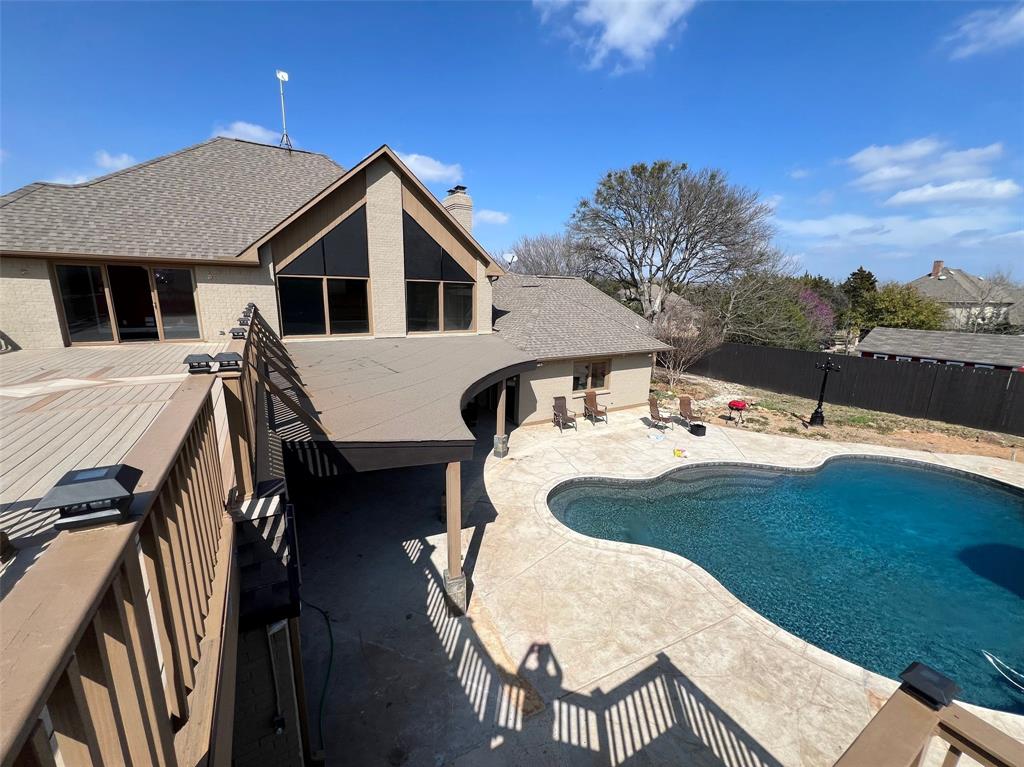 5890 Montgomery Road Midlothian, TX 76065 - Photo 2 of 38 a view of a patio with table and chairs with wooden floor and fence