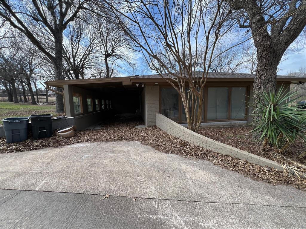 5890 Montgomery Road Midlothian, TX 76065 - Photo 31 of 38 a view of a house with a yard covered with snow in front of house