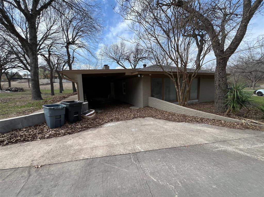 5890 Montgomery Road Midlothian, TX 76065 - Photo 32 of 38 a backyard of a house with table and chairs