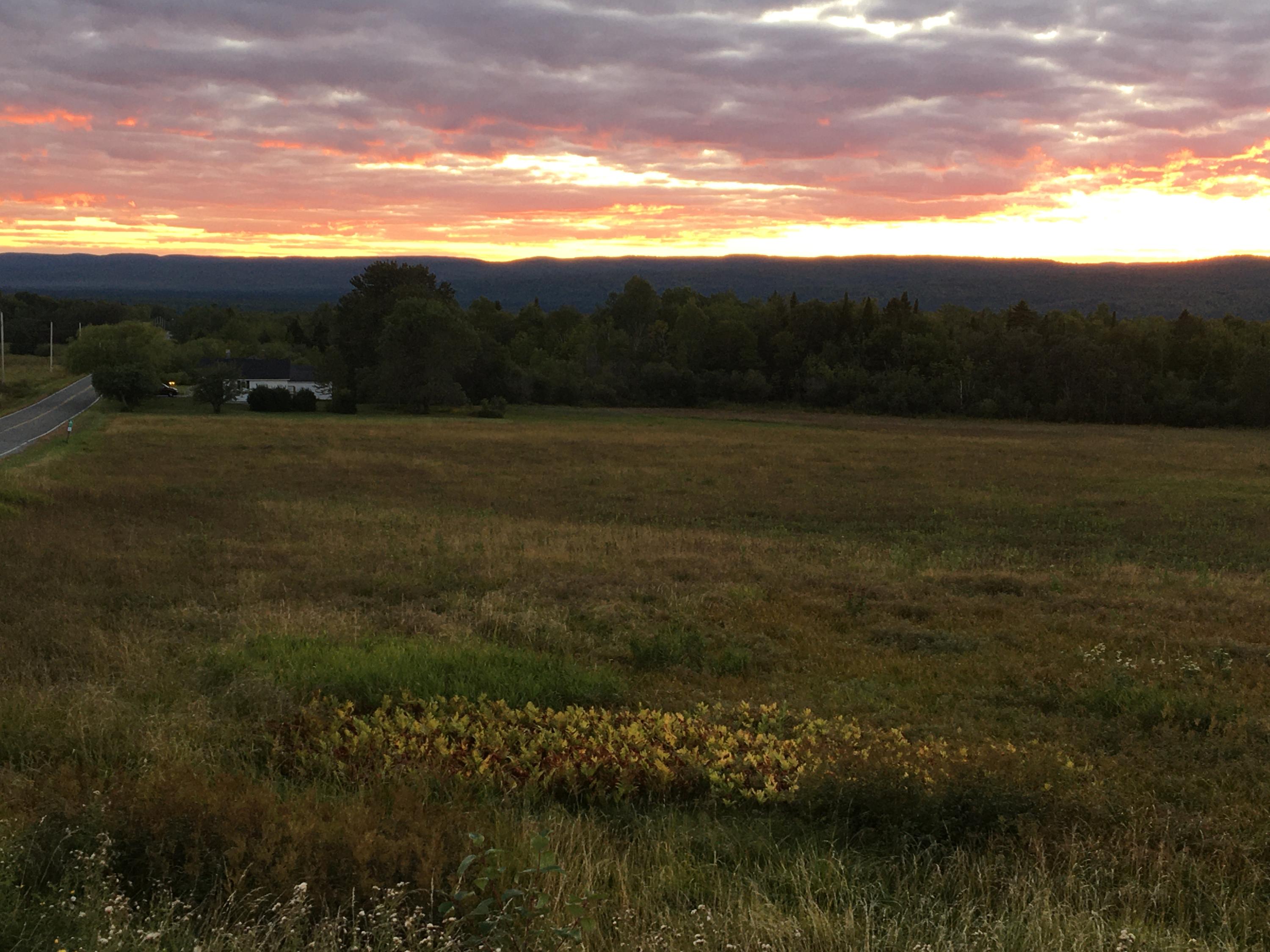 33 Quimby Road Winterville Plt, ME 04739 - Photo 33 of 34 View of field wioth housde at sunset