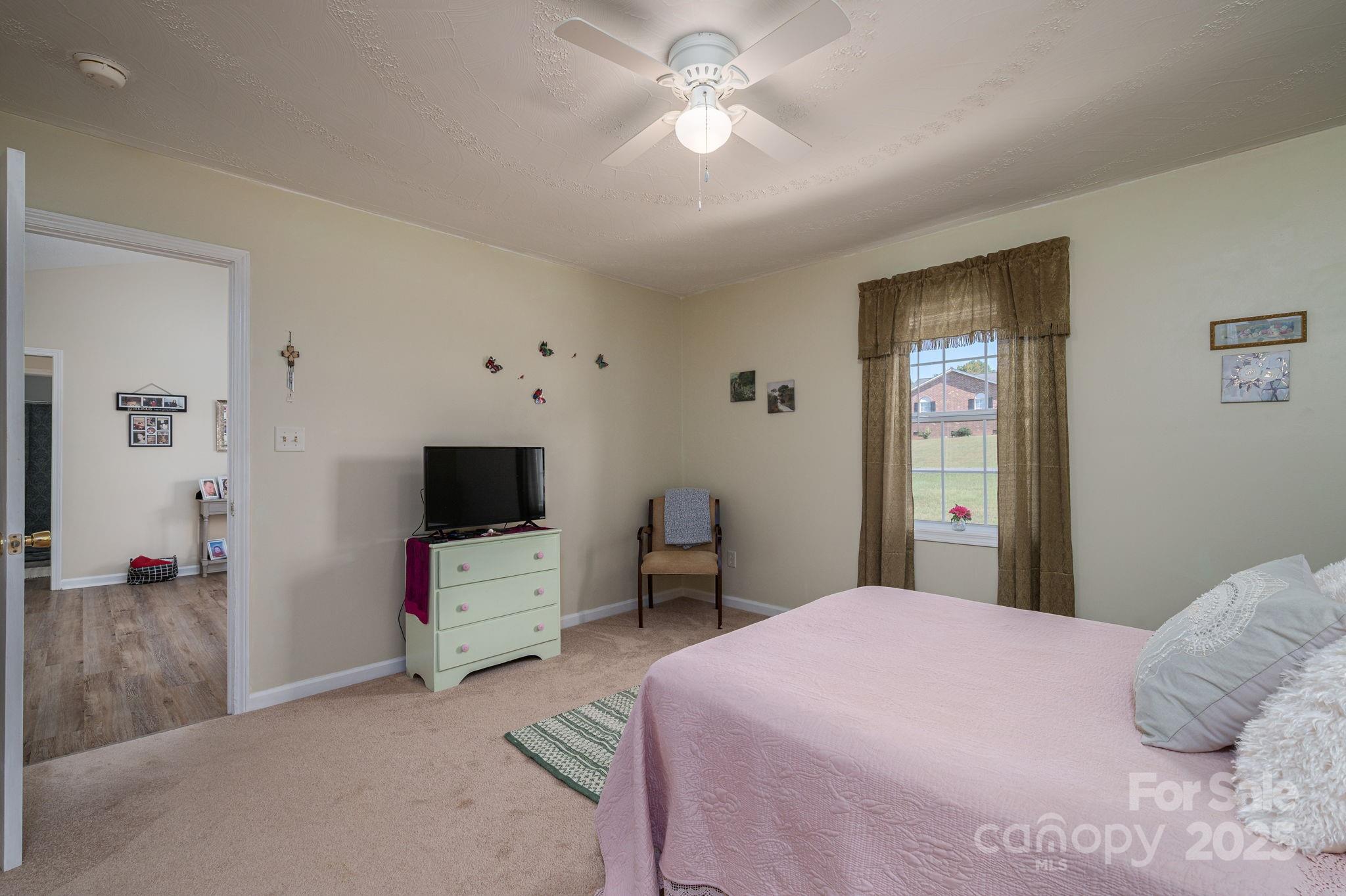 1371 Millrace Drive Conover, NC 28613 - Photo 16 of 36 a bedroom with a bed and a tv