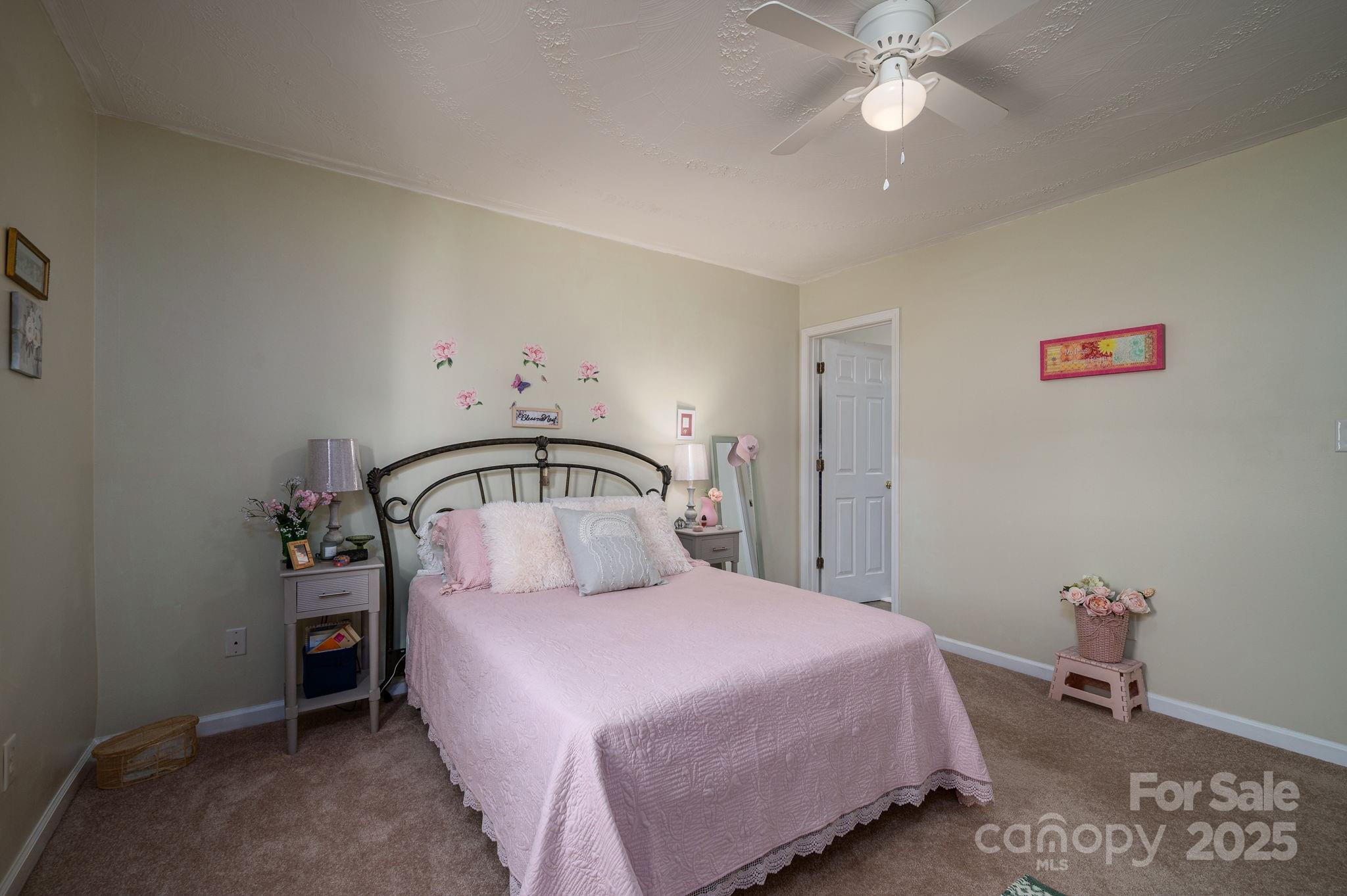 1371 Millrace Drive Conover, NC 28613 - Photo 17 of 36 a bedroom with a bed and a chandelier