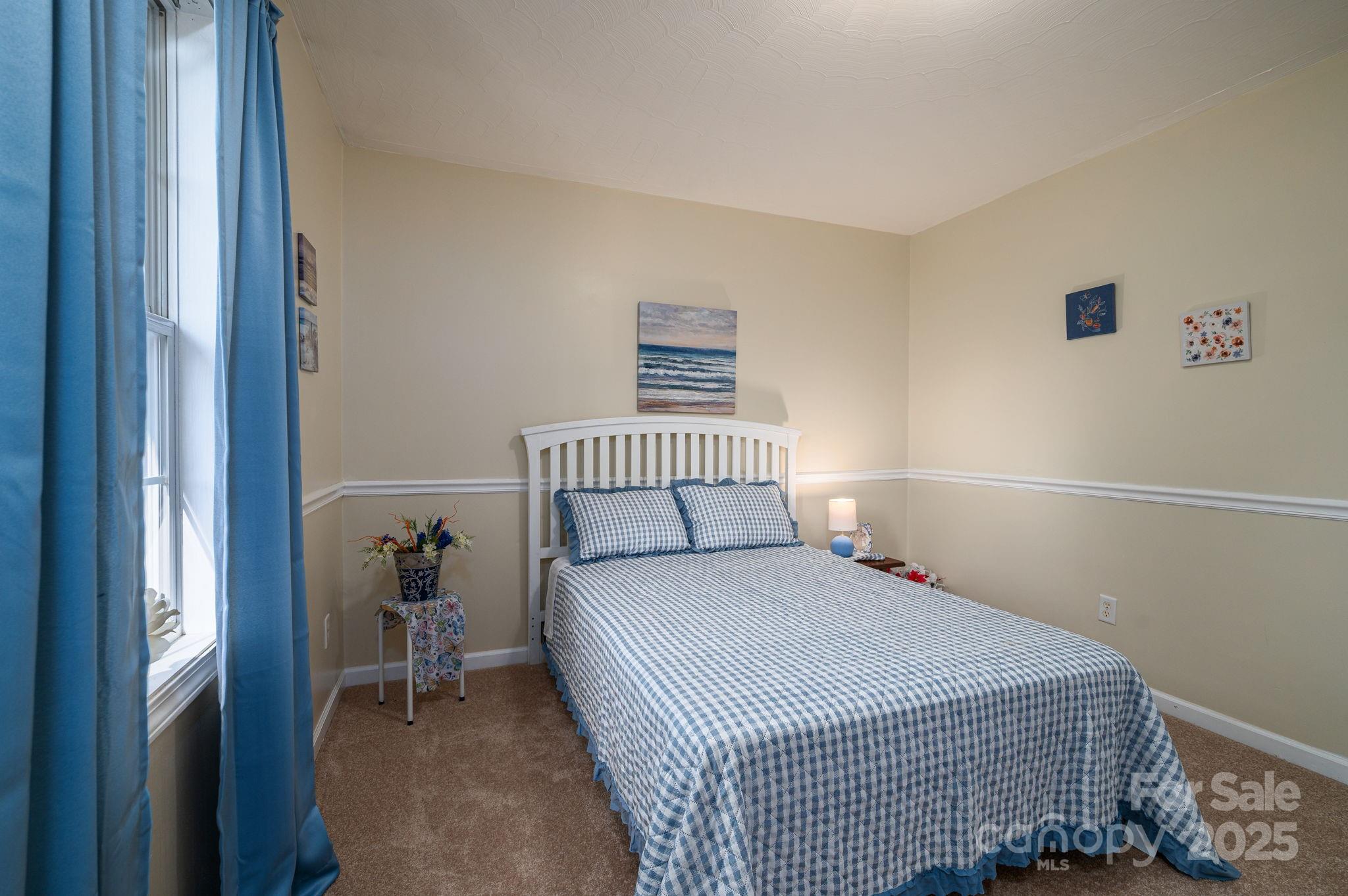 1371 Millrace Drive Conover, NC 28613 - Photo 19 of 36 a bedroom with a bed and a window