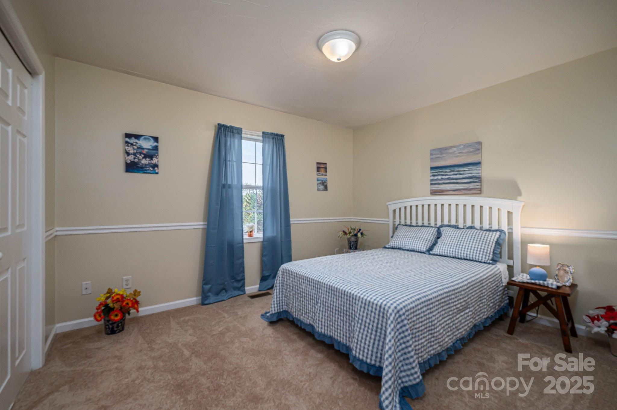 1371 Millrace Drive Conover, NC 28613 - Photo 20 of 36 a bedroom with a bed and a lamp