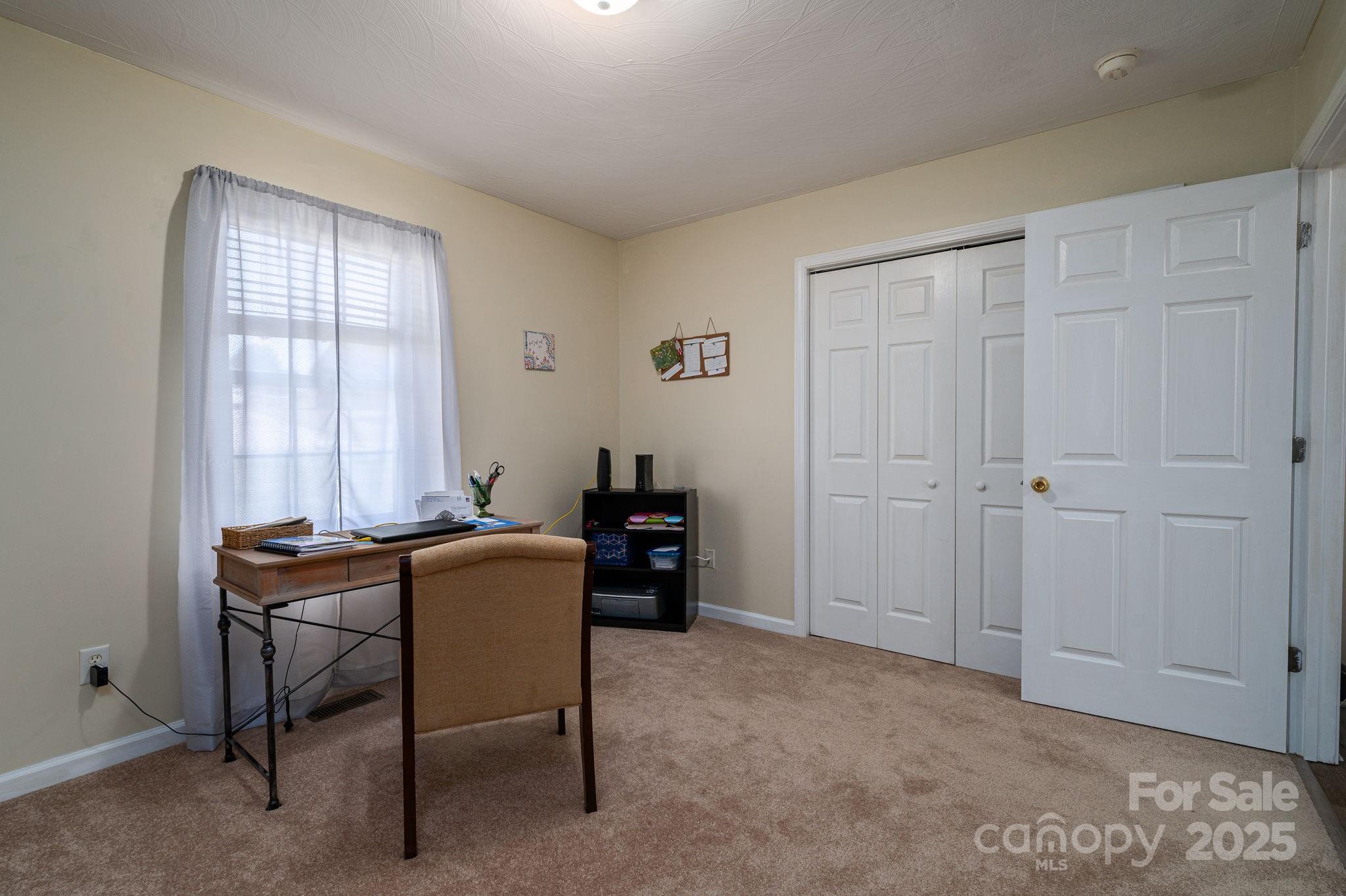 1371 Millrace Drive Conover, NC 28613 - Photo 22 of 36 a view of a workspace with furniture and a window