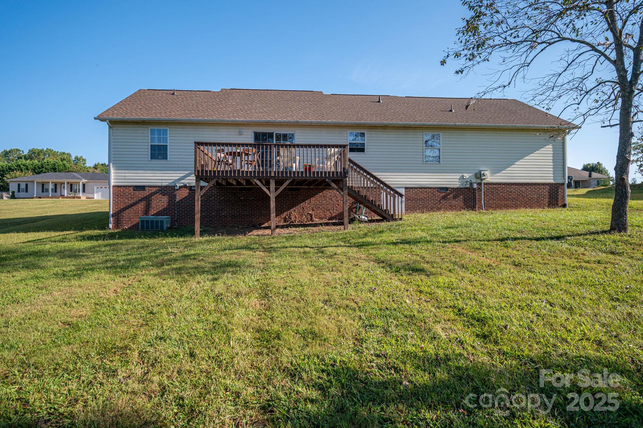 1371 Millrace Drive Conover, NC 28613 - Photo 31 of 36 a view of a backyard with a sitting area and slide