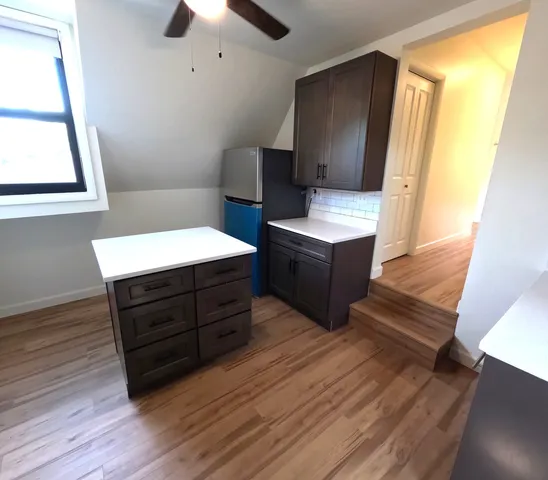 a room with wooden floors and window