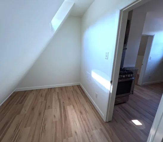 a view of wooden floor in an empty room