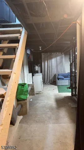 a view of a porch with furniture and a yard