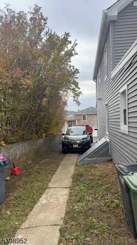 a view of a car parked in front of a house