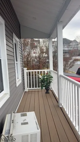 a view of balcony with wooden floor