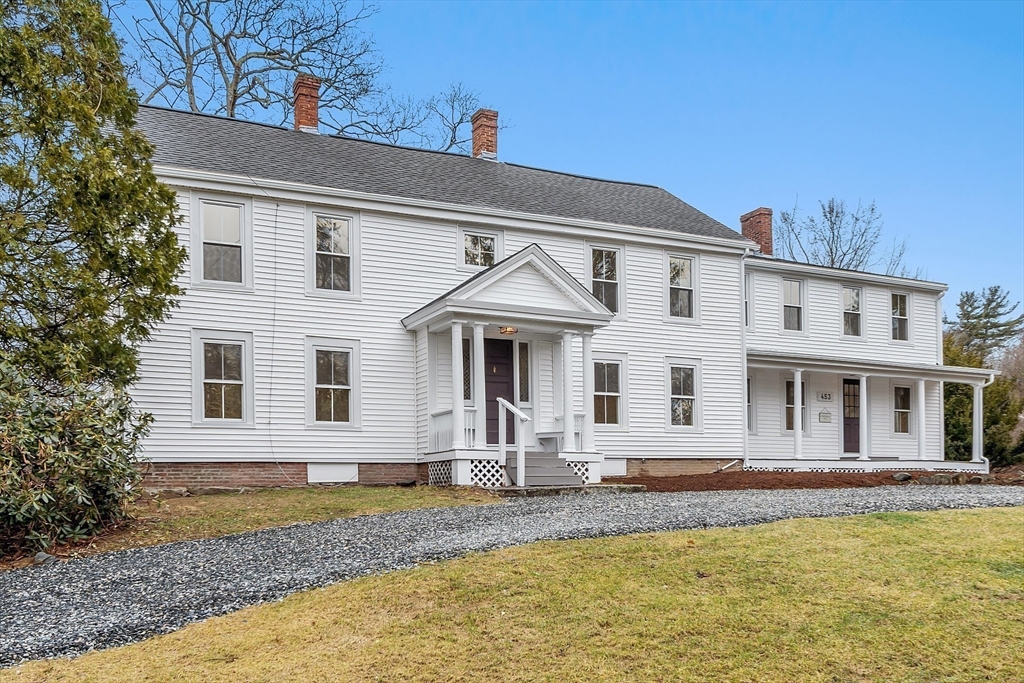 453 Main Street Northborough, MA 01532 - Photo 1 of 42 a front view of a house with garden