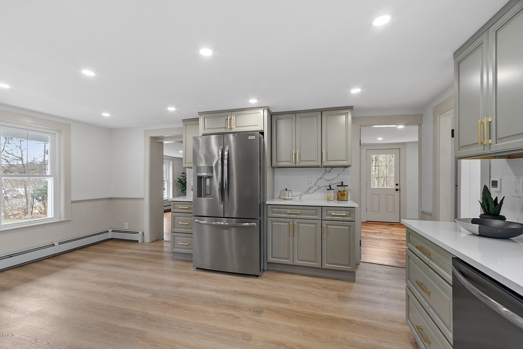 453 Main Street Northborough, MA 01532 - Photo 12 of 42 a kitchen with refrigerator and cabinets