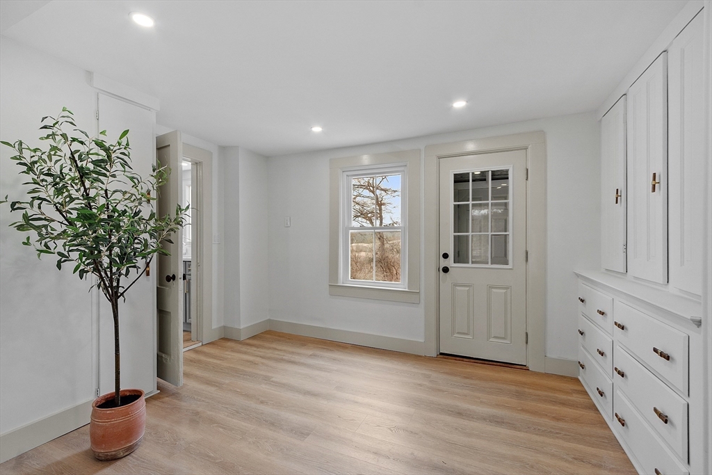 453 Main Street Northborough, MA 01532 - Photo 16 of 42 wooden floor in an empty room with a potted plant