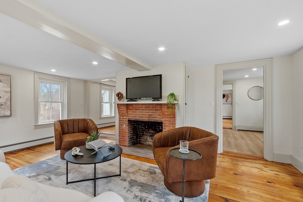 453 Main Street Northborough, MA 01532 - Photo 21 of 42 a living room with furniture and a fireplace