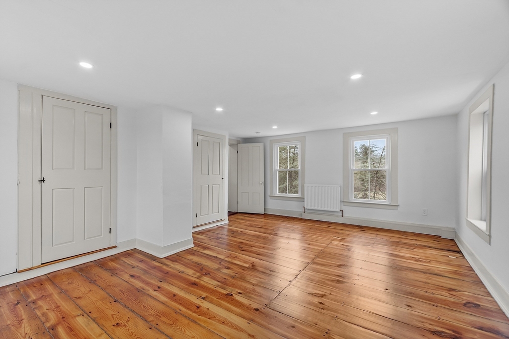 453 Main Street Northborough, MA 01532 - Photo 32 of 42 a view of room with window and wooden floor